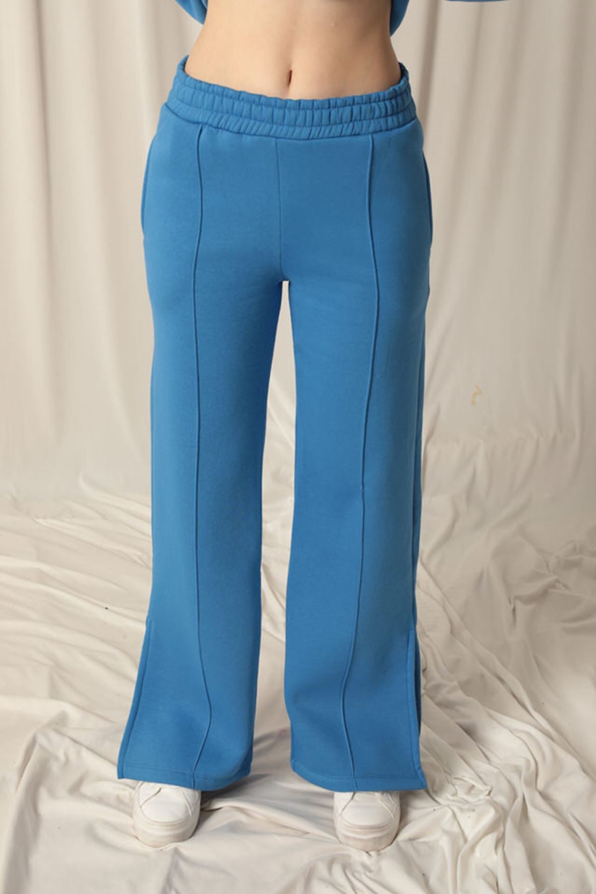 Üç iplik Biyeli Çimalı Yırtmaçlı Bol Paça Kadın Mavi Eşofman